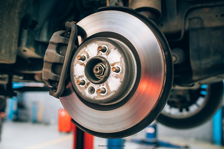 The exposed metal part of a wheel and the brake. The tire and other components were removed.