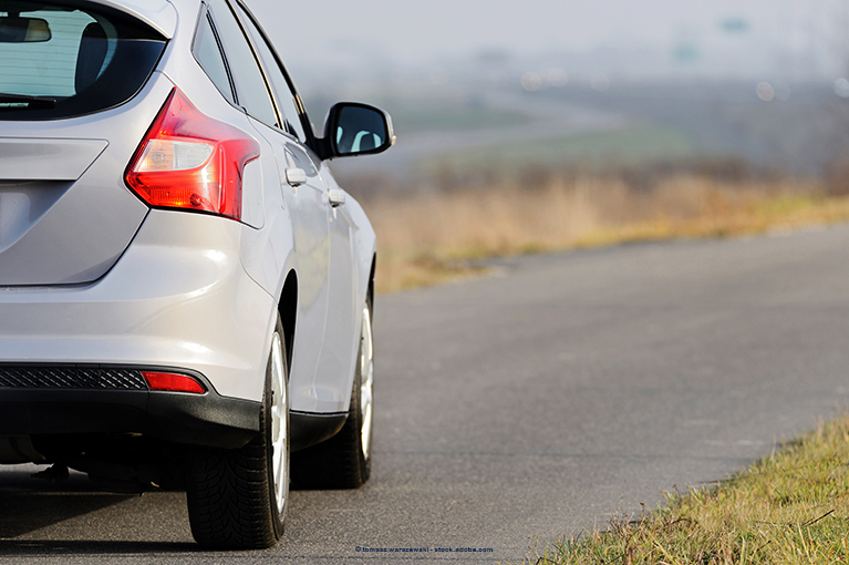 A white SUV is parked on an empty road. A class action lawsuit alleges that model year 2012–2016 Focus and 2011–2016 Fiesta cars are equipped with defective 6-speed dual-clutch semi-automatic (DPS6) transmissions. Defects include “shuddering, slipping, bucking, jerking, hesitation while changing gears, premature internal wear, delays in downshifting and, in some cases, sudden or delayed acceleration.”