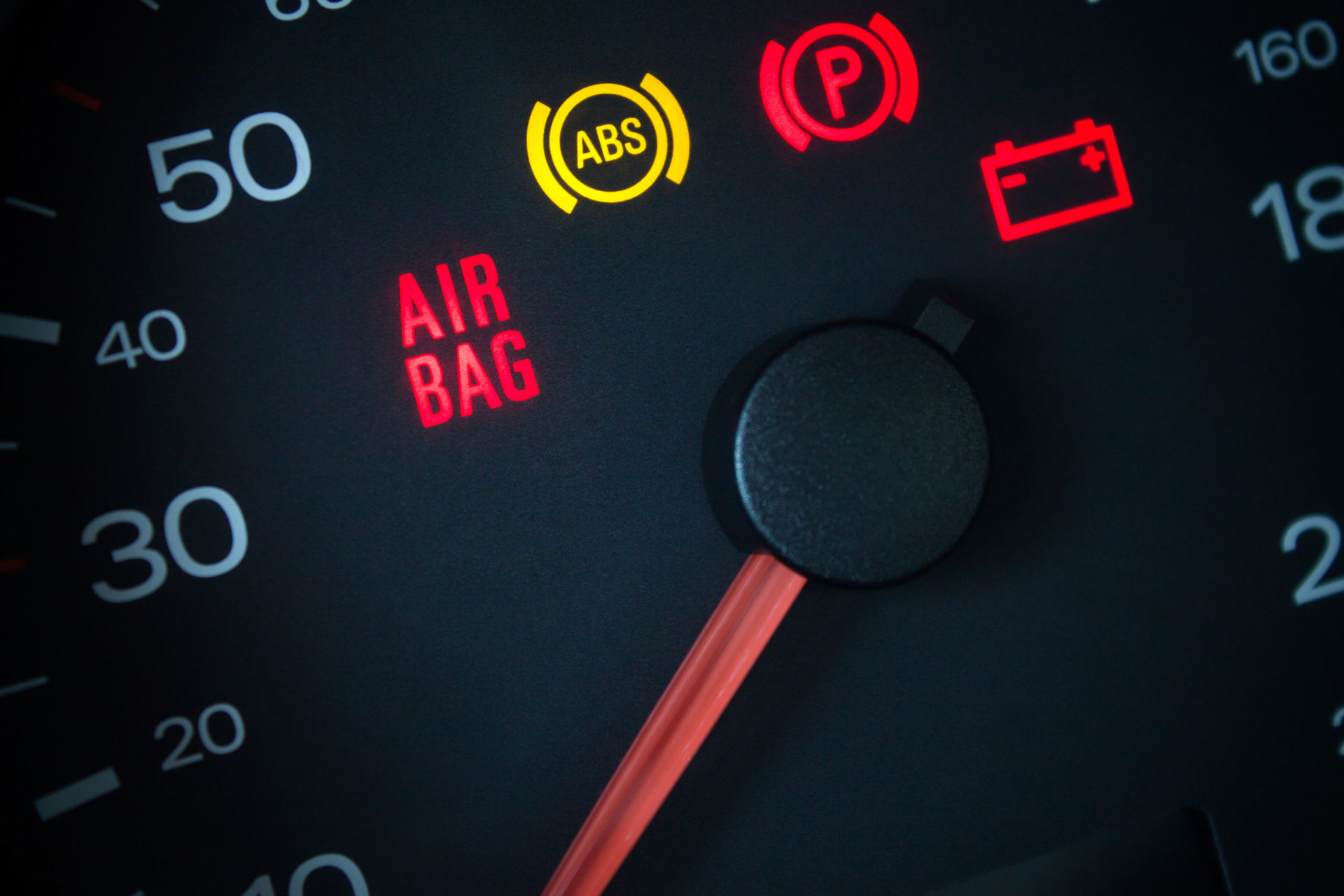 The Air Bag light, ABS light, Parking Brake light, and Battery light are lit up on the vehicle dashboard. We describe the top 5 Nissan vehicle issues.