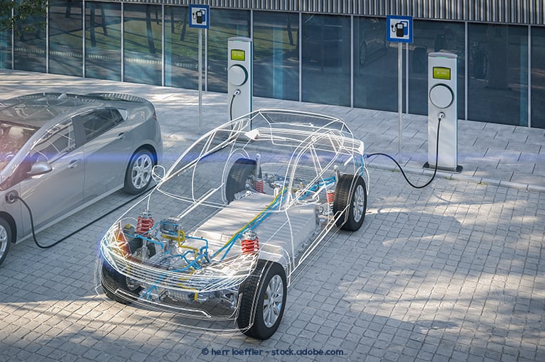 An infographic illustration of the electrical components and propulsion system of an electric vehicle. The electric vehicle itself, represented by an outline of the vehicle shape, is parked in an outdoor charging station.