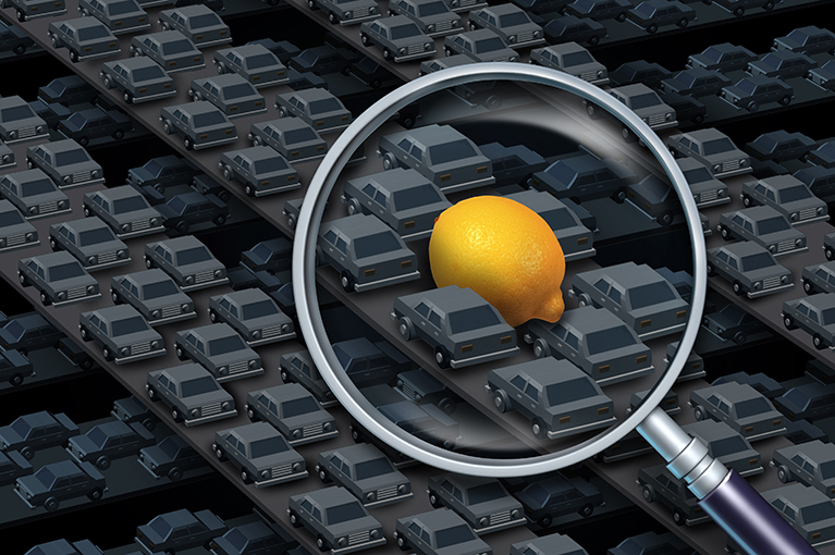 A magnifying glass hovers over a lemon, itself surrounded by small grey cars. The gray cars themselves appear to be on separated conveyor belts.