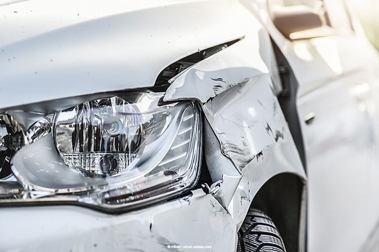 A white car has sustained damage to one of its headlights. 2016–2019 Honda Accords are equipped with a Honda Sensing system that allegedly makes your vehicle brake at random.
