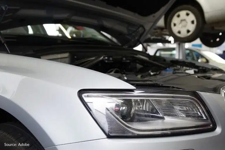 A grey vehicle has its hood popped open. It is parked in an auto repair shop. Owners and lessees of 2011–2016 Honda Odyssey minivans reported unexpected shaking, violent jerking, problems accelerating and transmission failure. Some consumers have reported that their torque converter clutch locks up.