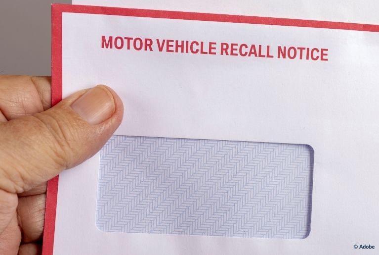 An empty envelope labeled "Motor Vehicle Recall Notice."