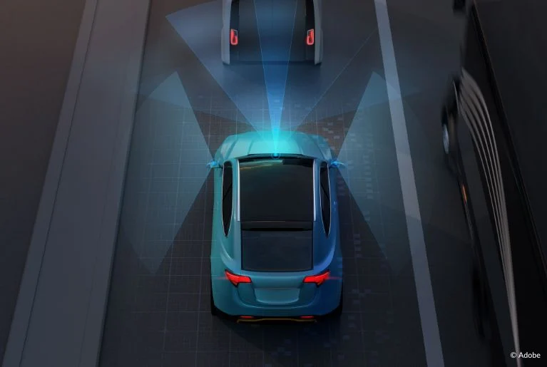 An infographic image of a blue car using radar systems to detect vehicles in front of it. Nissan Sentra cars may experience faults with their Automatic Emergency Braking systems.