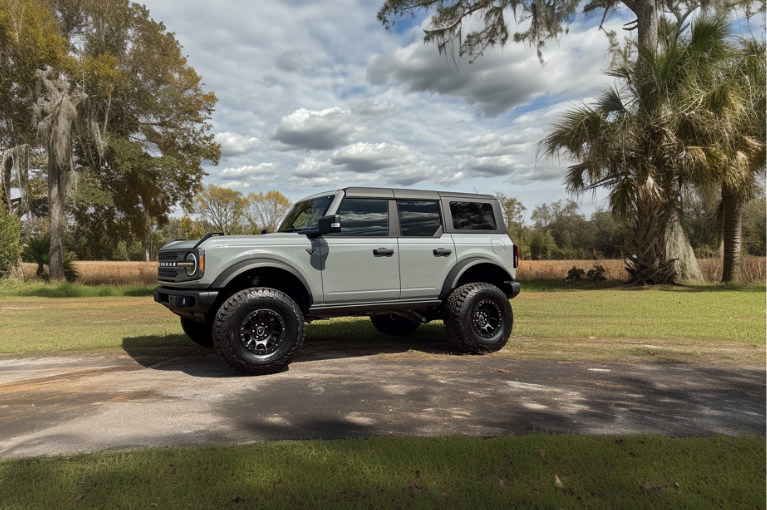 A grey 2021 Ford Bronco SUV is parked outside.