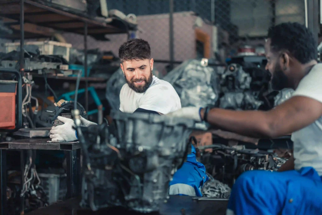 Close of up two service mechanics working