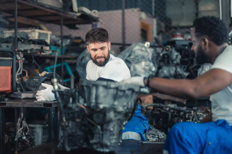 Close of up two service mechanics working