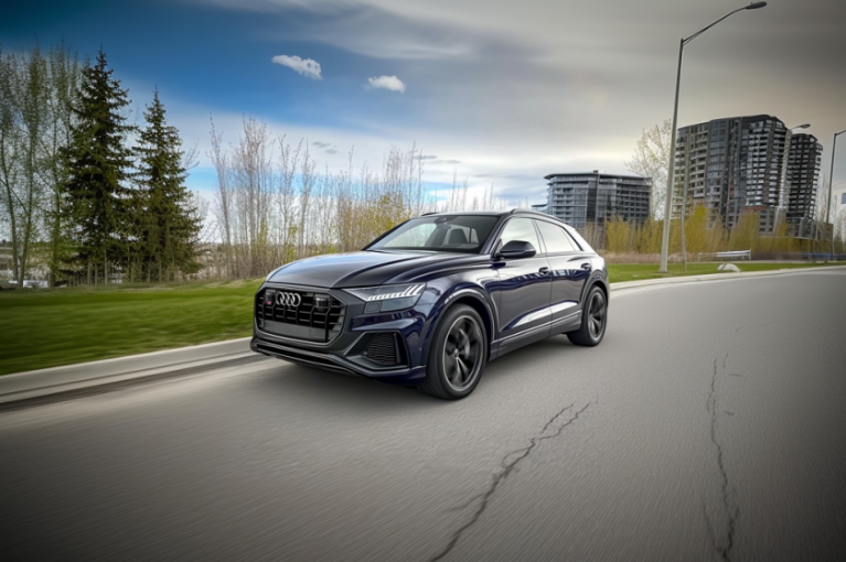 2021 Audi SQ8 A 2021 Audi SQ8 vehicle is parked on an empty street near a park. Several 2021 Audi vehicles are under recall for instrument panel display failures that make the screens go blank.