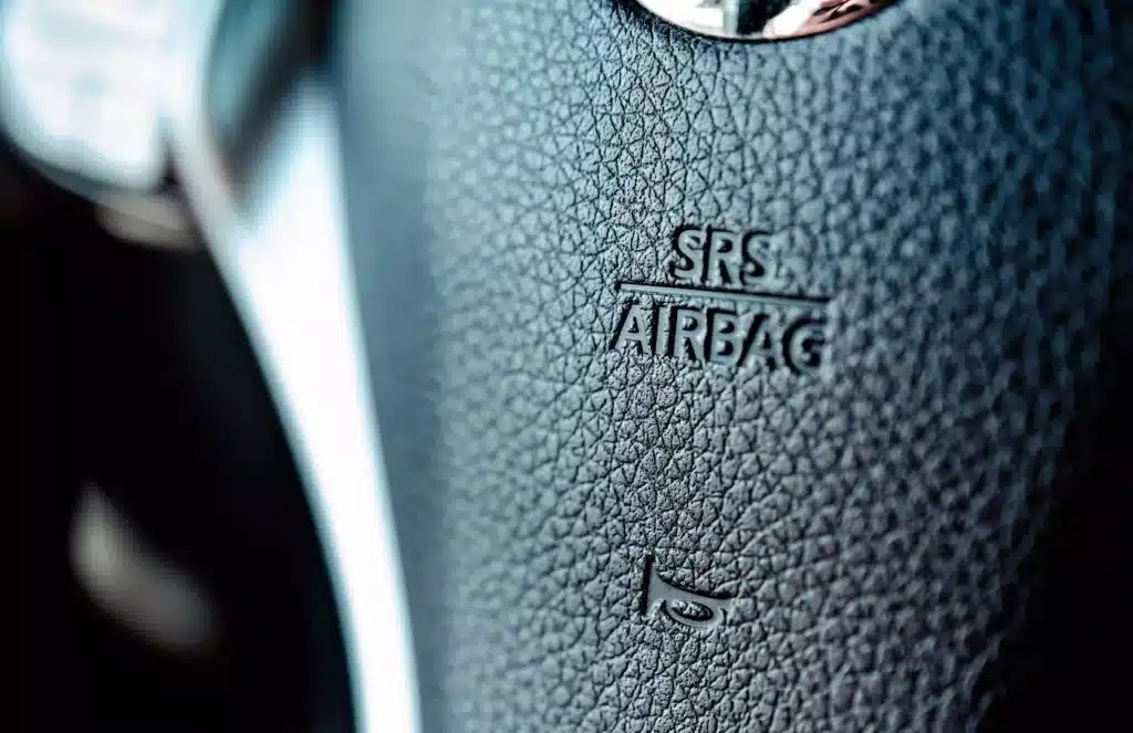 Close up of airbag sign on steering wheel