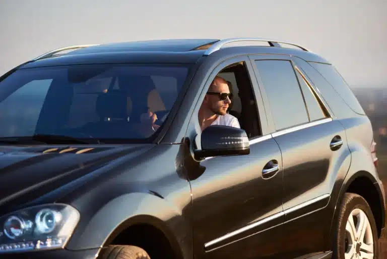 Man driving SUV